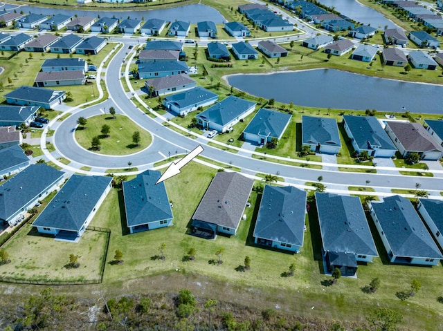 745 SE Bloomfield Rd, Port Saint Lucie, FL 34984 - aerial perspective of suburban area with a large body of water