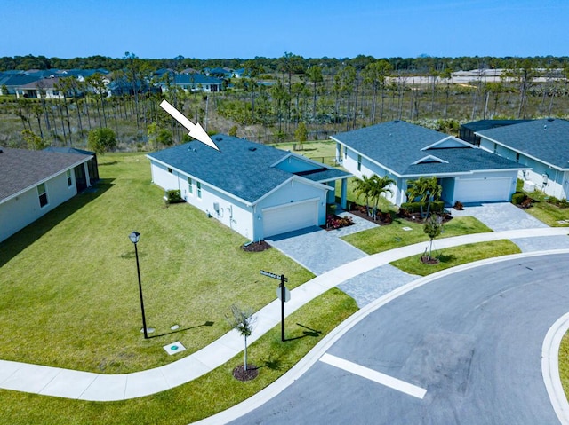 745 SE Bloomfield Rd, Port Saint Lucie, FL 34984 - aerial perspective of suburban area
