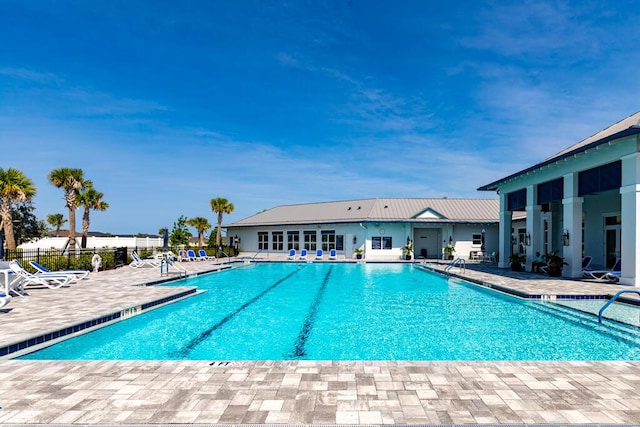 745 SE Bloomfield Rd, Port Saint Lucie, FL 34984 - community pool featuring a patio area and fence