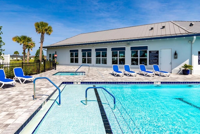 745 SE Bloomfield Rd, Port Saint Lucie, FL 34984 - community pool featuring fence, a patio area, and a community hot tub