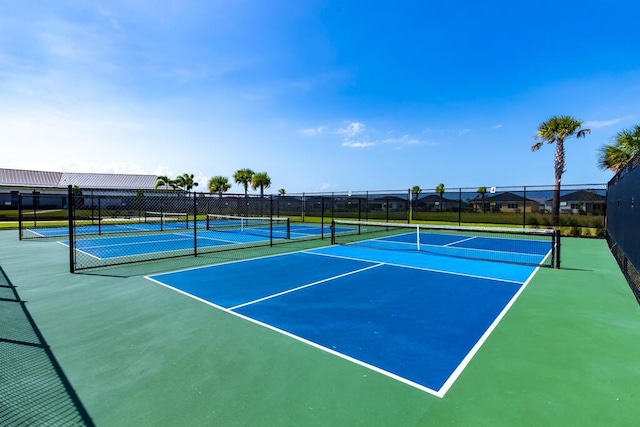 745 SE Bloomfield Rd, Port Saint Lucie, FL 34984 - view of tennis court with fence