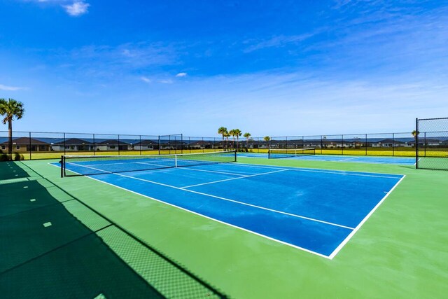 745 SE Bloomfield Rd, Port Saint Lucie, FL 34984 - view of tennis court featuring fence