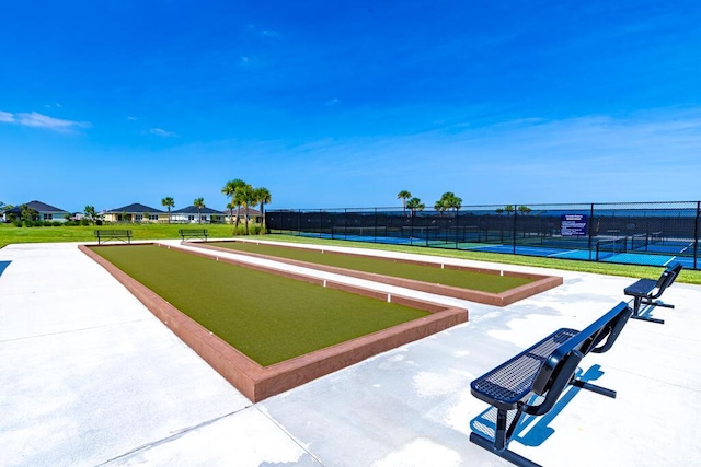 745 SE Bloomfield Rd, Port Saint Lucie, FL 34984 - surrounding community featuring a game area, a tennis court, and fence