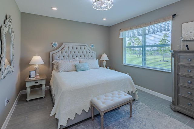 745 SE Bloomfield Rd, Port Saint Lucie, FL 34984 - bedroom with baseboards, wood finish floors, and recessed lighting