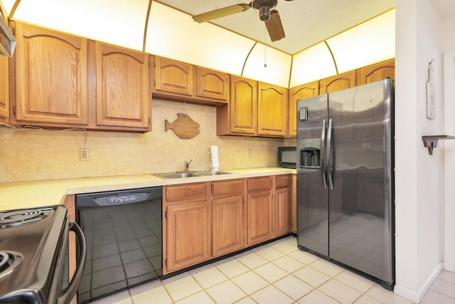 kitchen featuring black appliances, a sink, light countertops, ceiling fan, and backsplash