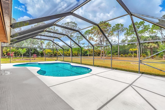 outdoor pool featuring a patio, a yard, and a lanai
