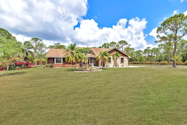 ranch-style home with a front yard