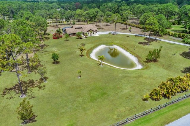 bird's eye view of a large body of water and a heavily wooded area
