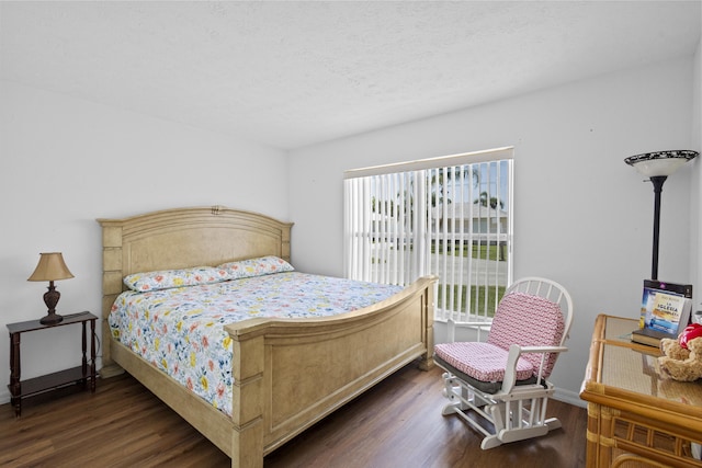 6527 Alheli, Fort Pierce, FL 34951 - bedroom with dark wood-style flooring, baseboards, and a textured ceiling