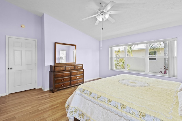 6527 Alheli, Fort Pierce, FL 34951 - bedroom featuring lofted ceiling, wood finished floors, baseboards, and a ceiling fan