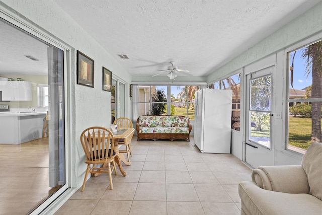 6527 Alheli, Fort Pierce, FL 34951 - sunroom / solarium featuring a textured ceiling, tile patterned floors, and a sink