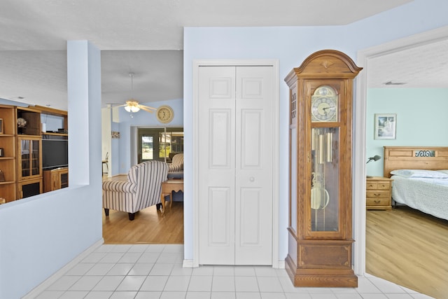 6527 Alheli, Fort Pierce, FL 34951 - hallway with light tile patterned floors, baseboards, and a textured ceiling