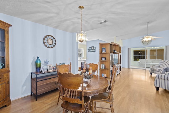 6527 Alheli, Fort Pierce, FL 34951 - dining space with light wood-style floors, a chandelier, and ceiling fan