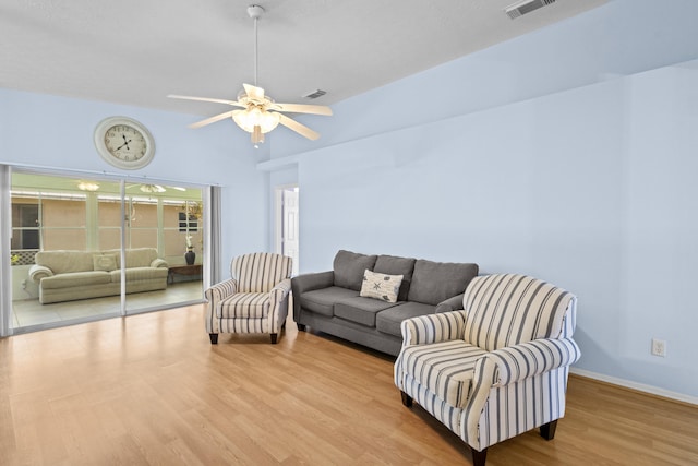 6527 Alheli, Fort Pierce, FL 34951 - living room featuring wood finished floors, a ceiling fan, and baseboards