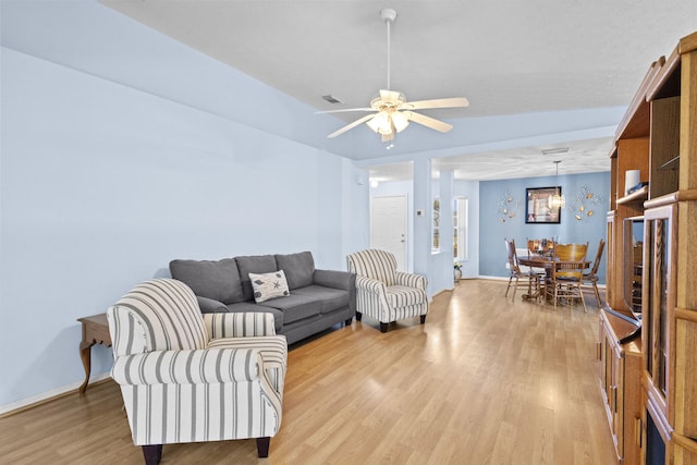 6527 Alheli, Fort Pierce, FL 34951 - living room with light wood-style flooring, ceiling fan, and baseboards