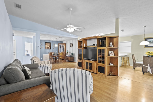 6527 Alheli, Fort Pierce, FL 34951 - living area with light wood finished floors, ceiling fan, and baseboards