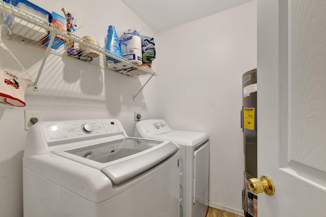 555 SW Sara Blvd, Port Saint Lucie, FL 34953 - laundry room with separate washer and dryer and light wood-style flooring