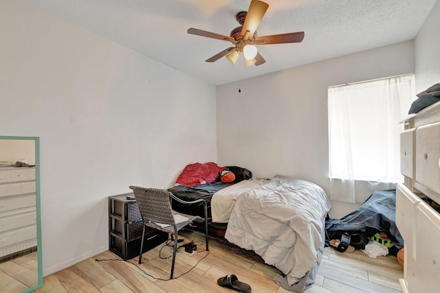 555 SW Sara Blvd, Port Saint Lucie, FL 34953 - bedroom featuring light wood-style floors and ceiling fan