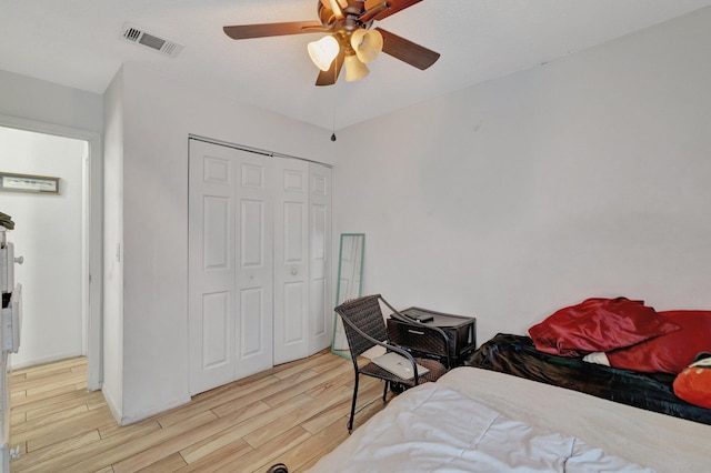 555 SW Sara Blvd, Port Saint Lucie, FL 34953 - bedroom featuring wood finished floors, a closet, and ceiling fan