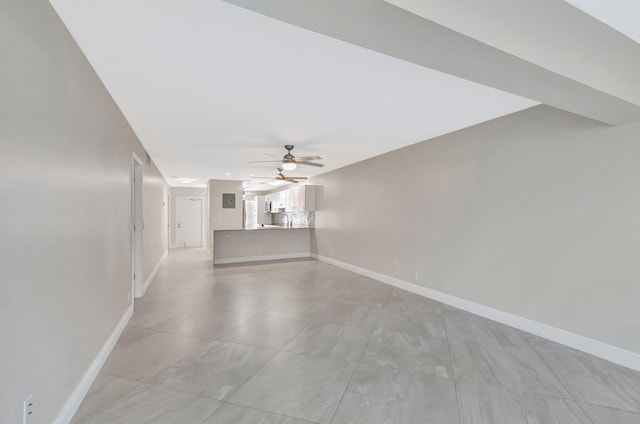 1131 Violet Ter Unit 104, Delray Beach, FL 33445 - unfurnished living room featuring a ceiling fan and baseboards