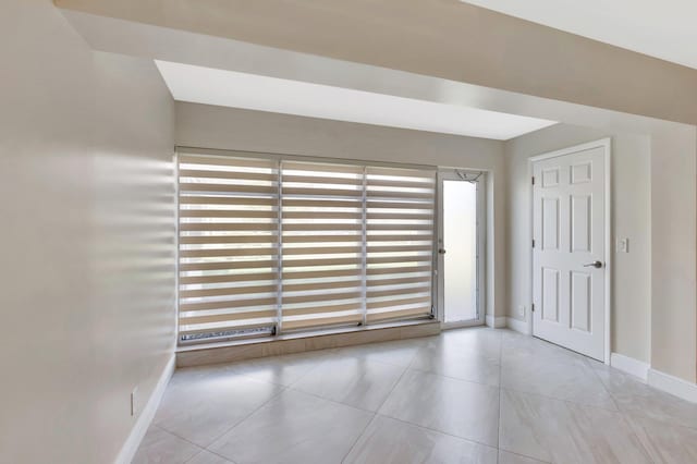 1131 Violet Ter Unit 104, Delray Beach, FL 33445 - tiled spare room with baseboards