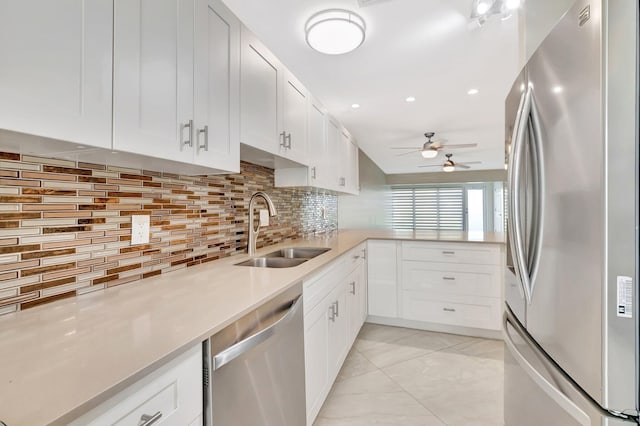 1131 Violet Ter Unit 104, Delray Beach, FL 33445 - kitchen with appliances with stainless steel finishes, a sink, a ceiling fan, and tasteful backsplash