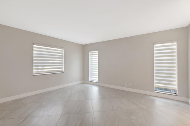 1131 Violet Ter Unit 104, Delray Beach, FL 33445 - empty room with baseboards and light tile patterned flooring