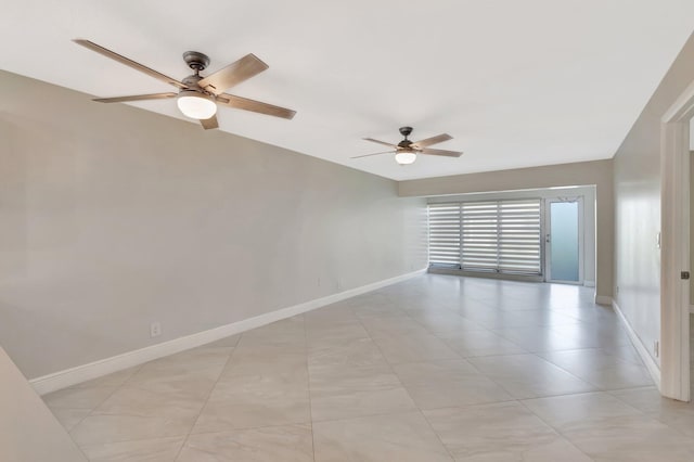 1131 Violet Ter Unit 104, Delray Beach, FL 33445 - spare room with baseboards, a ceiling fan, and light tile patterned floors