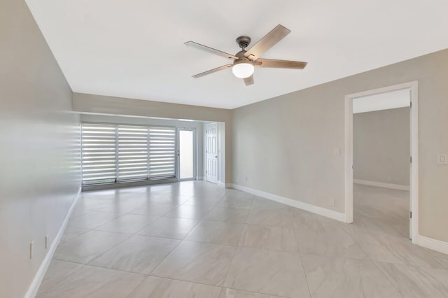 1131 Violet Ter Unit 104, Delray Beach, FL 33445 - spare room featuring ceiling fan, baseboards, and light tile patterned floors