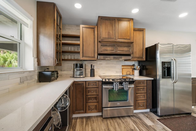 kitchen featuring stainless steel appliances, open shelves, decorative backsplash, recessed lighting, and under cabinet range hood