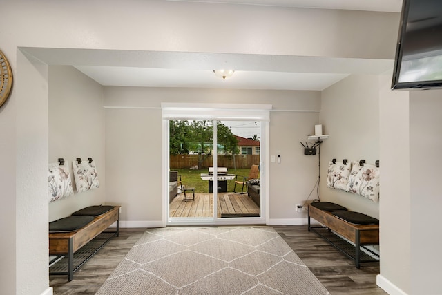 entryway with wood finished floors and baseboards