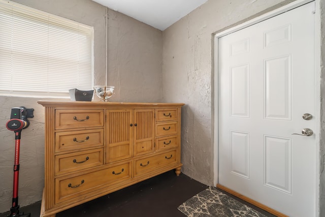 bedroom featuring a textured wall