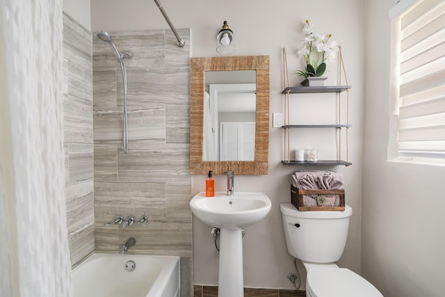 bathroom featuring toilet and shower / washtub combination