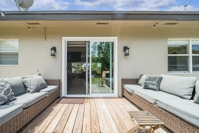 deck featuring outdoor lounge area
