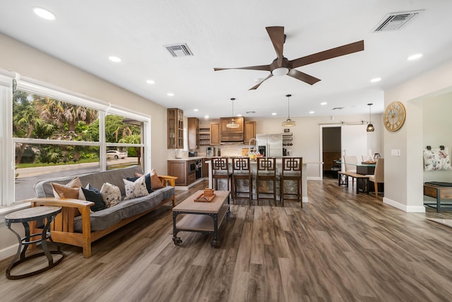living room with a ceiling fan, baseboards, dark wood-style flooring, and recessed lighting