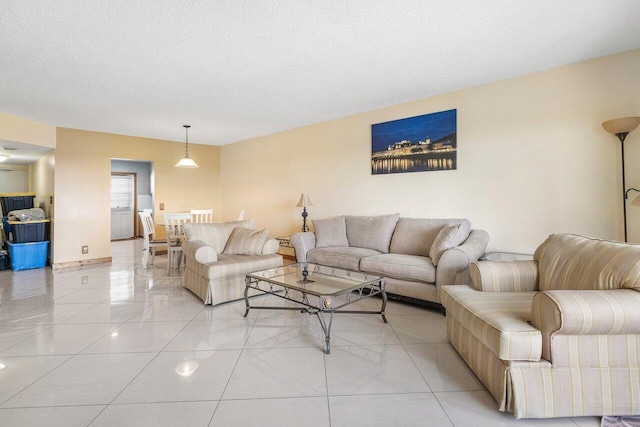 9101 W Sample Rd Unit 805, Coral Springs, FL 33065 - living area featuring light tile patterned floors and a textured ceiling