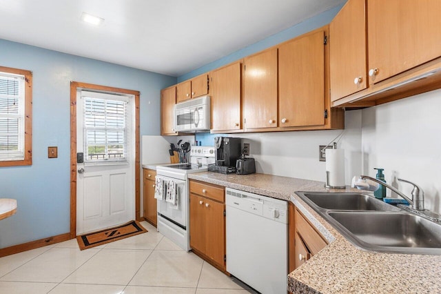 9101 W Sample Rd Unit 805, Coral Springs, FL 33065 - kitchen with white appliances, a sink, light countertops, light tile patterned floors, and baseboards