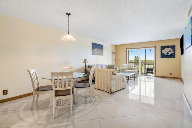 9101 W Sample Rd Unit 805, Coral Springs, FL 33065 - living area featuring baseboards, a textured ceiling, and light tile patterned flooring
