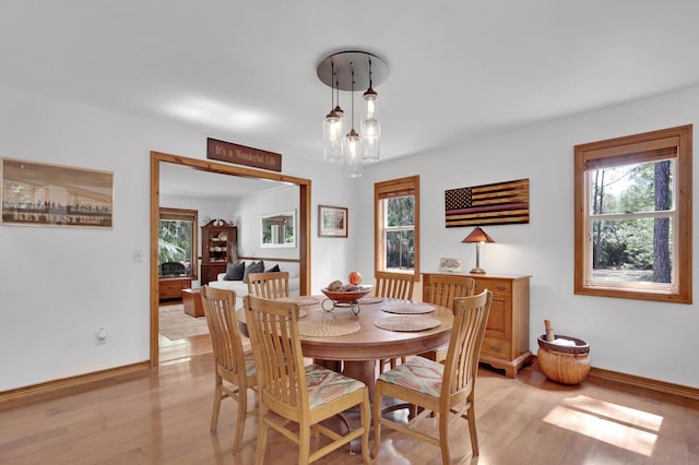 11868 161st St N, Jupiter, FL 33478 - dining space with light wood-style flooring and baseboards