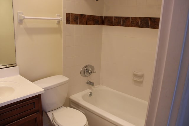 bathroom with toilet, vanity, and bathing tub / shower combination