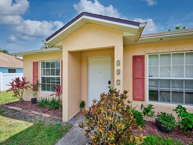 537 SW Hiawatha St, Port Saint Lucie, FL 34953 - property entrance with stucco siding and fence