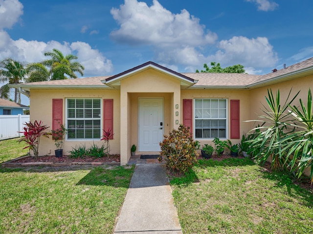 537 SW Hiawatha St, Port Saint Lucie, FL 34953 - ranch-style home featuring stucco siding and a shingled roof