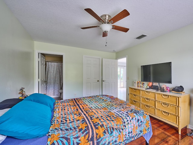 537 SW Hiawatha St, Port Saint Lucie, FL 34953 - bedroom with wood finished floors, ceiling fan, and connected bathroom