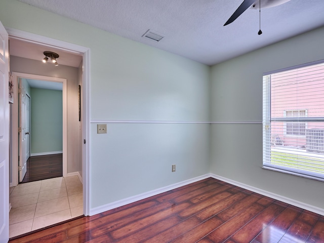537 SW Hiawatha St, Port Saint Lucie, FL 34953 - empty room with ceiling fan, wood finished floors, and baseboards