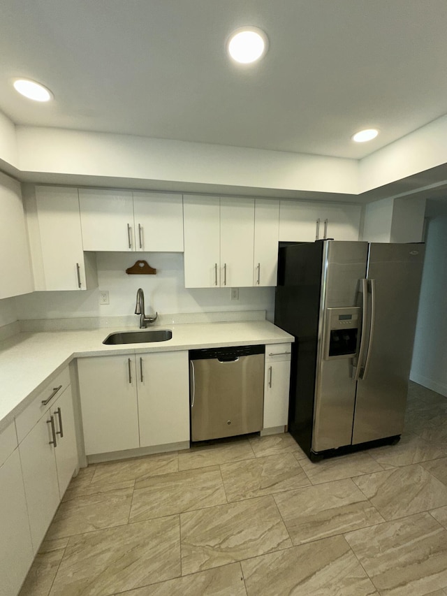 851 Three Islands Blvd Unit 102, Hallandale Beach, FL 33009 - kitchen featuring stainless steel appliances, a sink, white cabinetry, and recessed lighting