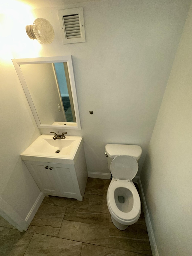 851 Three Islands Blvd Unit 102, Hallandale Beach, FL 33009 - half bath with baseboards, vanity, and toilet