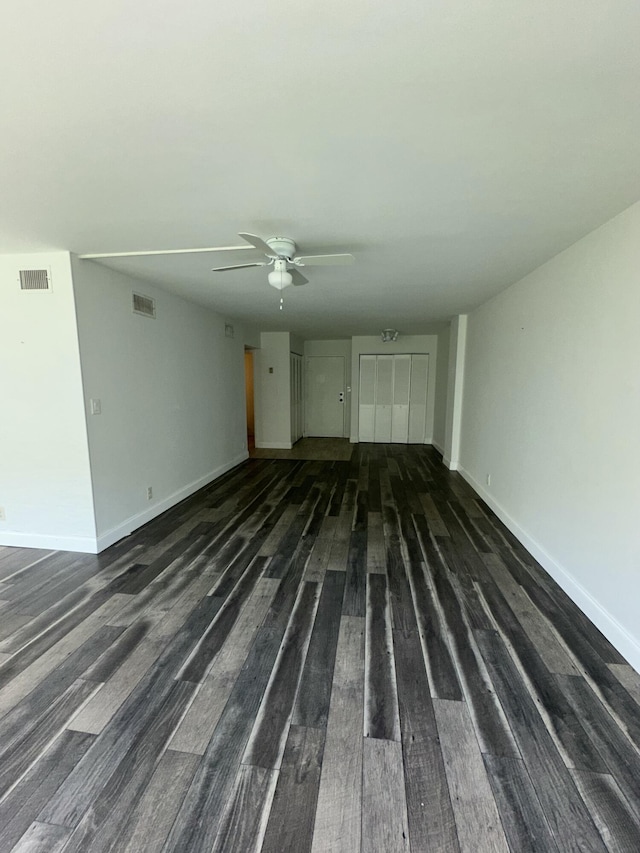 851 Three Islands Blvd Unit 102, Hallandale Beach, FL 33009 - unfurnished living room featuring ceiling fan, wood finished floors, and baseboards