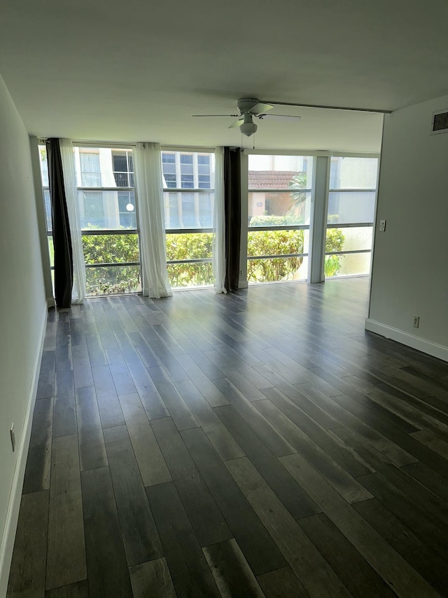 851 Three Islands Blvd Unit 102, Hallandale Beach, FL 33009 - empty room with ceiling fan, dark wood-type flooring, and baseboards