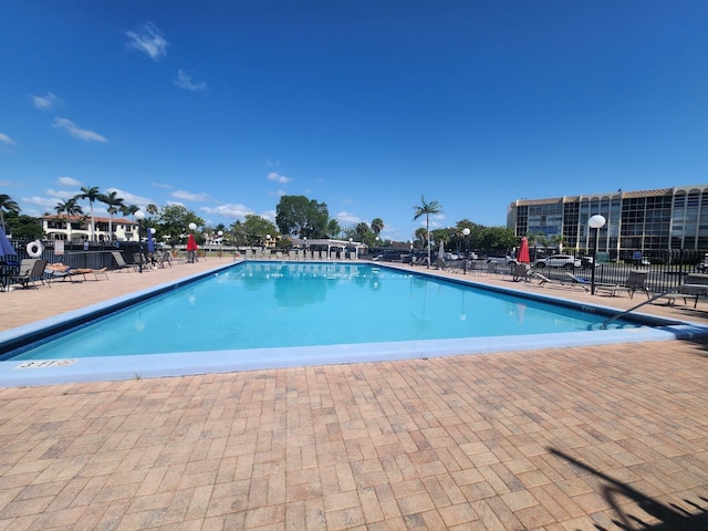851 Three Islands Blvd Unit 102, Hallandale Beach, FL 33009 - community pool with a patio area and fence