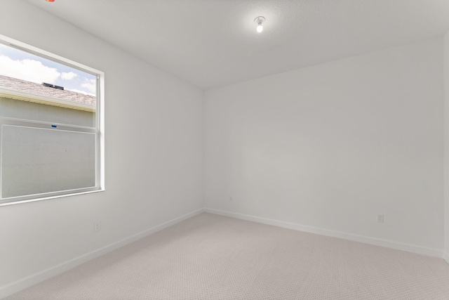 13461 SW Bally Dr, Port Saint Lucie, FL 34987 - unfurnished room with light colored carpet and baseboards